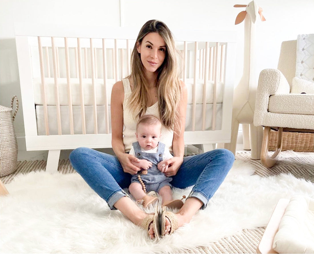 organizing nursery, mom and baby with first shoes, stay on baby boots 6m