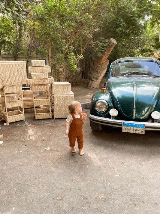 Minimalist toddler outfit with sunglasses and stay-on baby boots — perfect barefoot shoes for travel, parks, and everyday play
