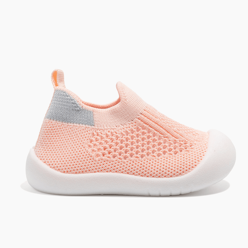 Lightweight infant first walking shoes with protective toe caps and gentle arch support, ideal for babies transitioning from crawling to walking.